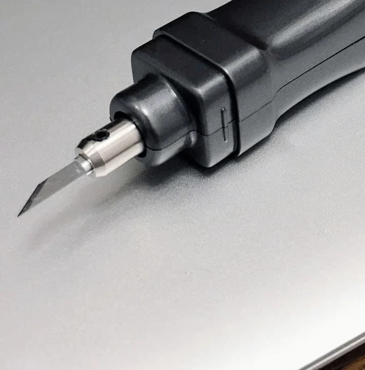 Close view of the cutting blade and metal holder on the black SonicCutter
