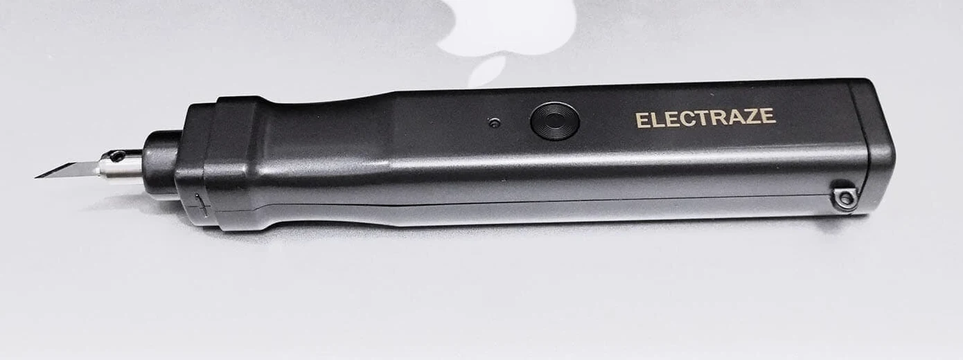 Side profile of the black SonicCutter showing its cutting blade and handheld body